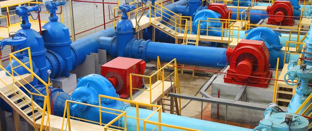 multi colored pipe system transporting steam in a utility center